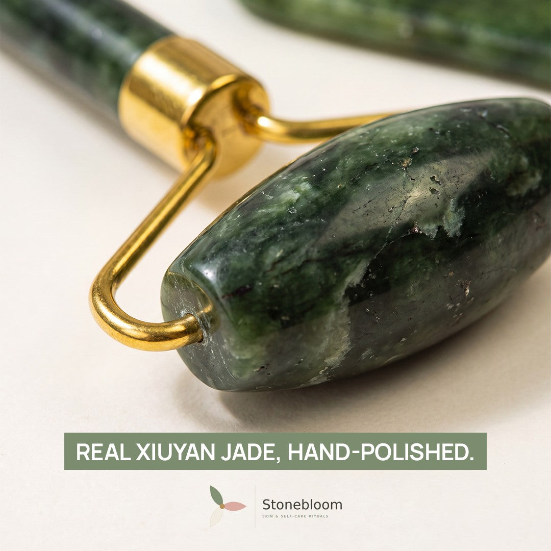 Close-up of the natural Xiuyan jade roller head showing the stone's veining and hand-polished finish